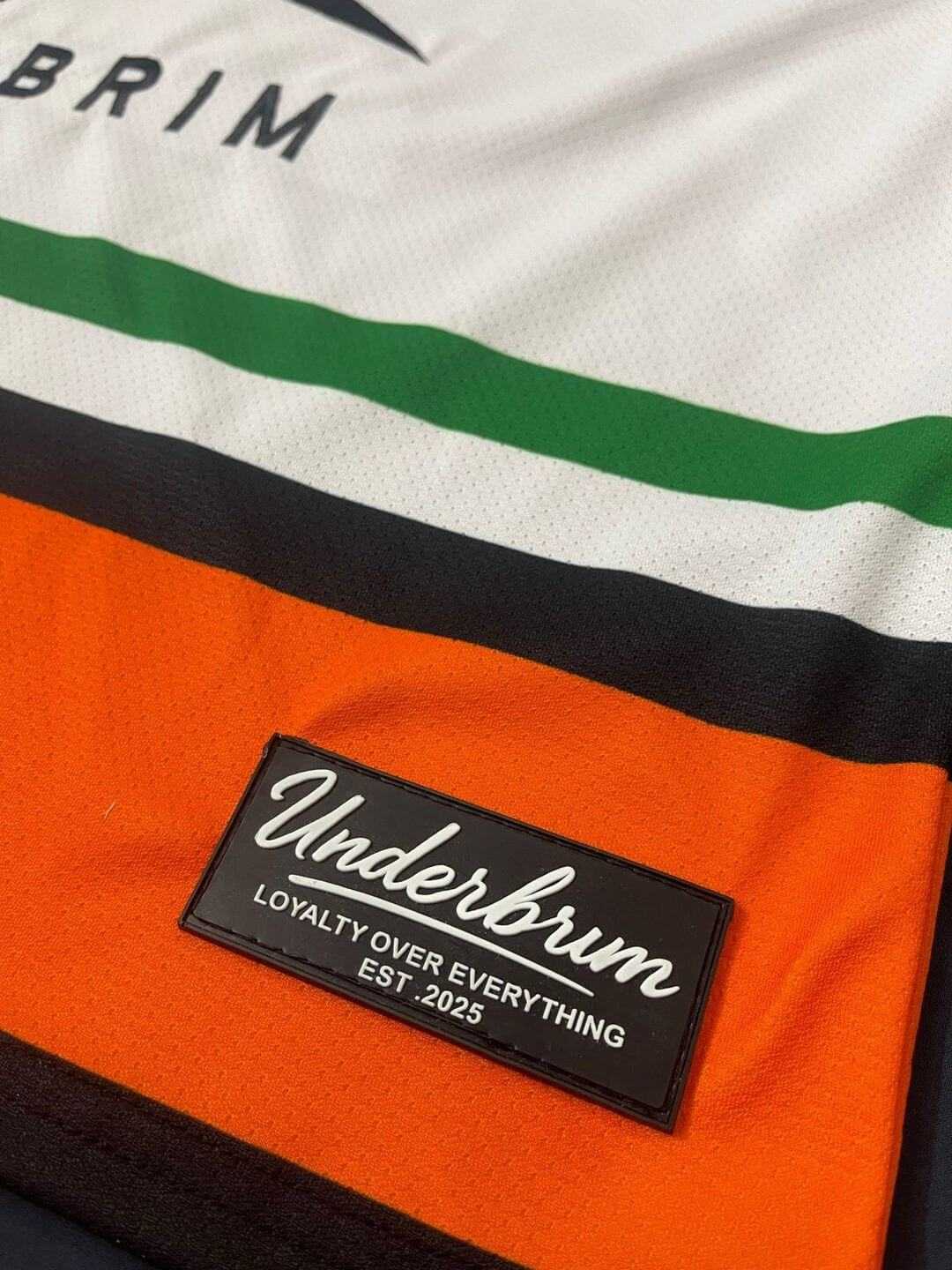 Limited edition streetwear jersey showcasing Underbrim logo and custom embroidery detail.