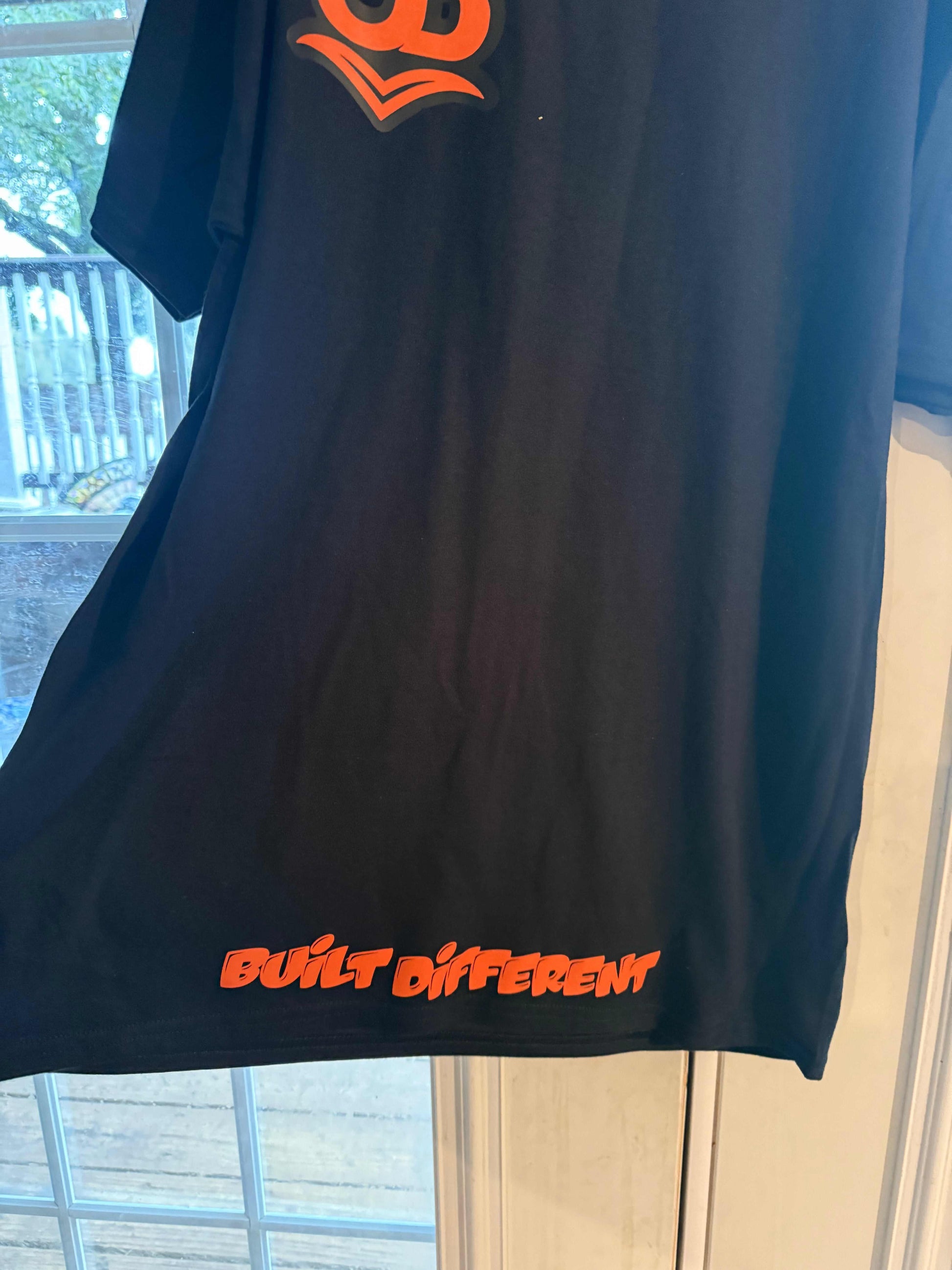 underbrim front view with Built different  slogan 